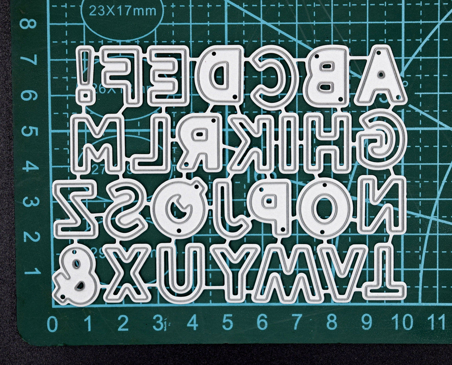 Alphabet metal cutting dies size reference on cutting mat for papercrafts