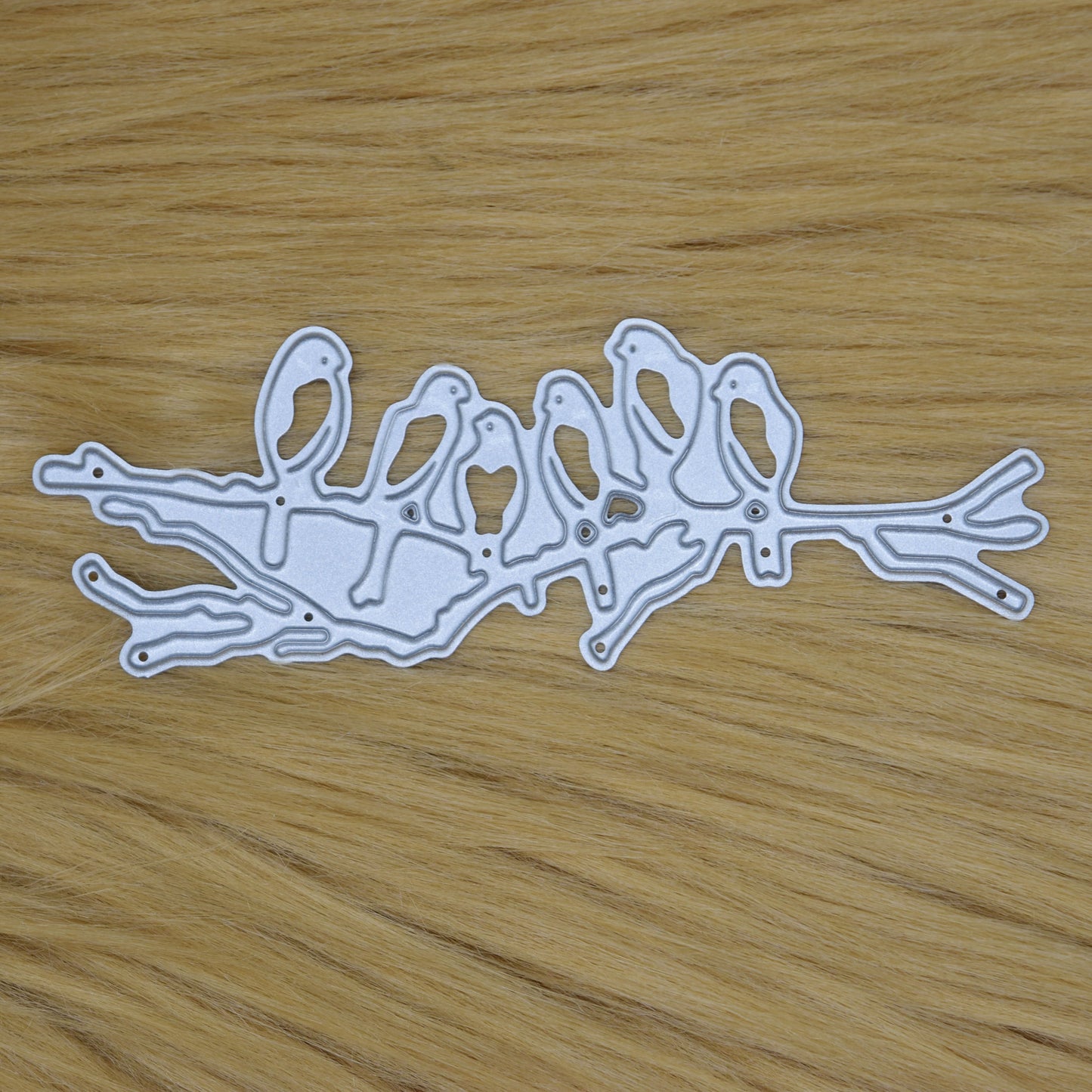 Birds on branch metal cutting die on faux fur background
