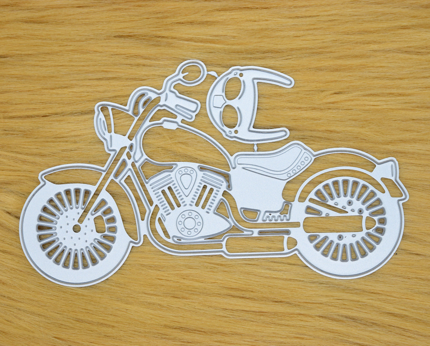 Motorbike metal cutting die on faux fur background