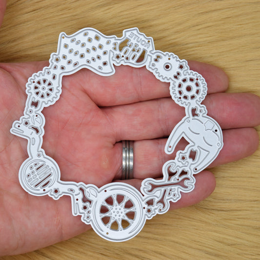 Motorbike frame metal cutting die held in hand showing size