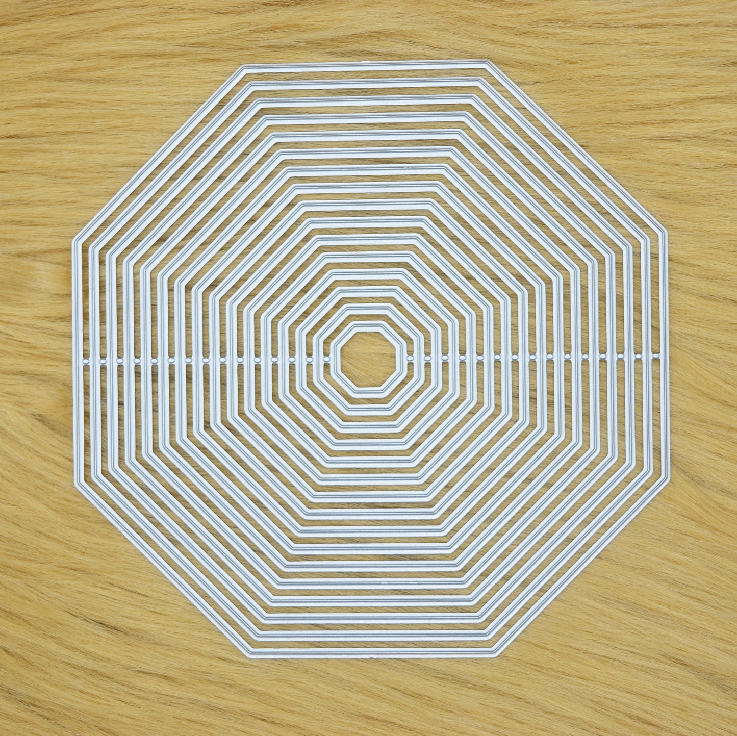 Octagon nesting cutting dies set on faux fur surface