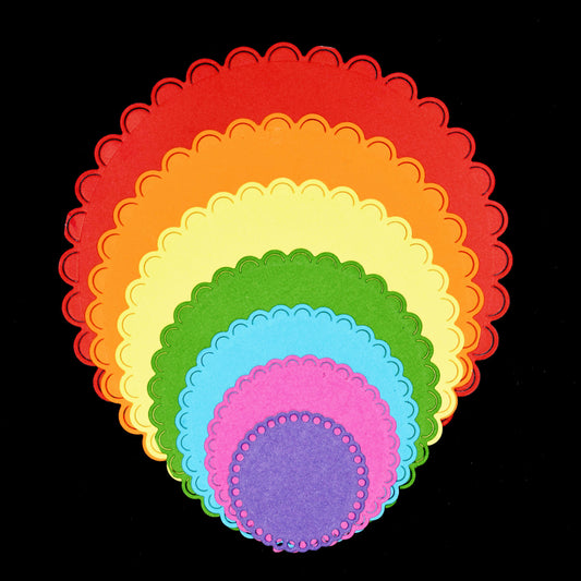 Layered scalloped circle paper die cuts made with metal cutting dies for card making