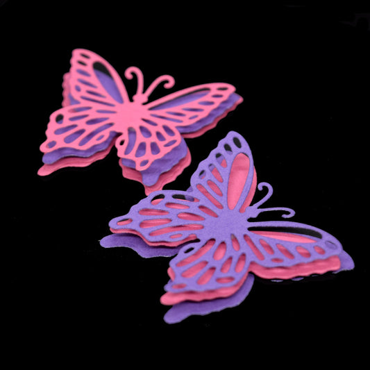 Layered 3D butterfly die cuts in pink and purple cardstock for card making and papercraft