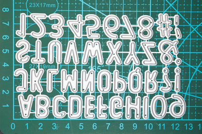 Alphabet cutting dies on cutting mat showing size reference