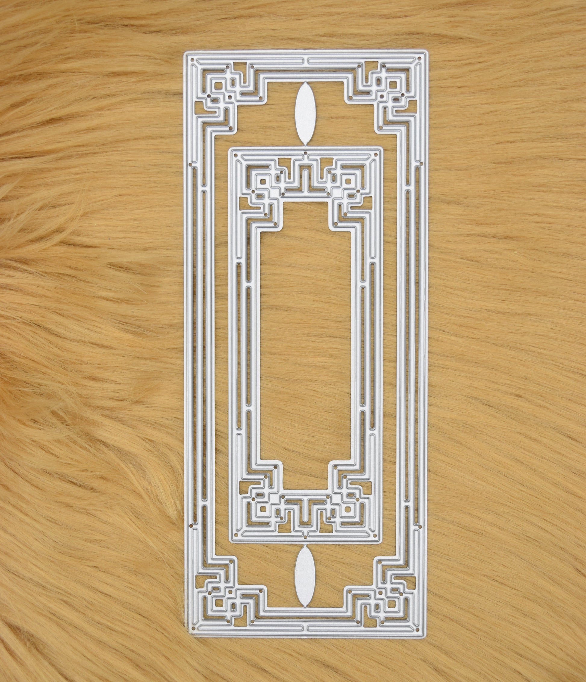 2 piece Art Deco rectangle frame metal cutting dies on faux fur background