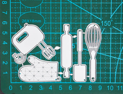 Baking themed metal cutting dies on measuring mat showing size