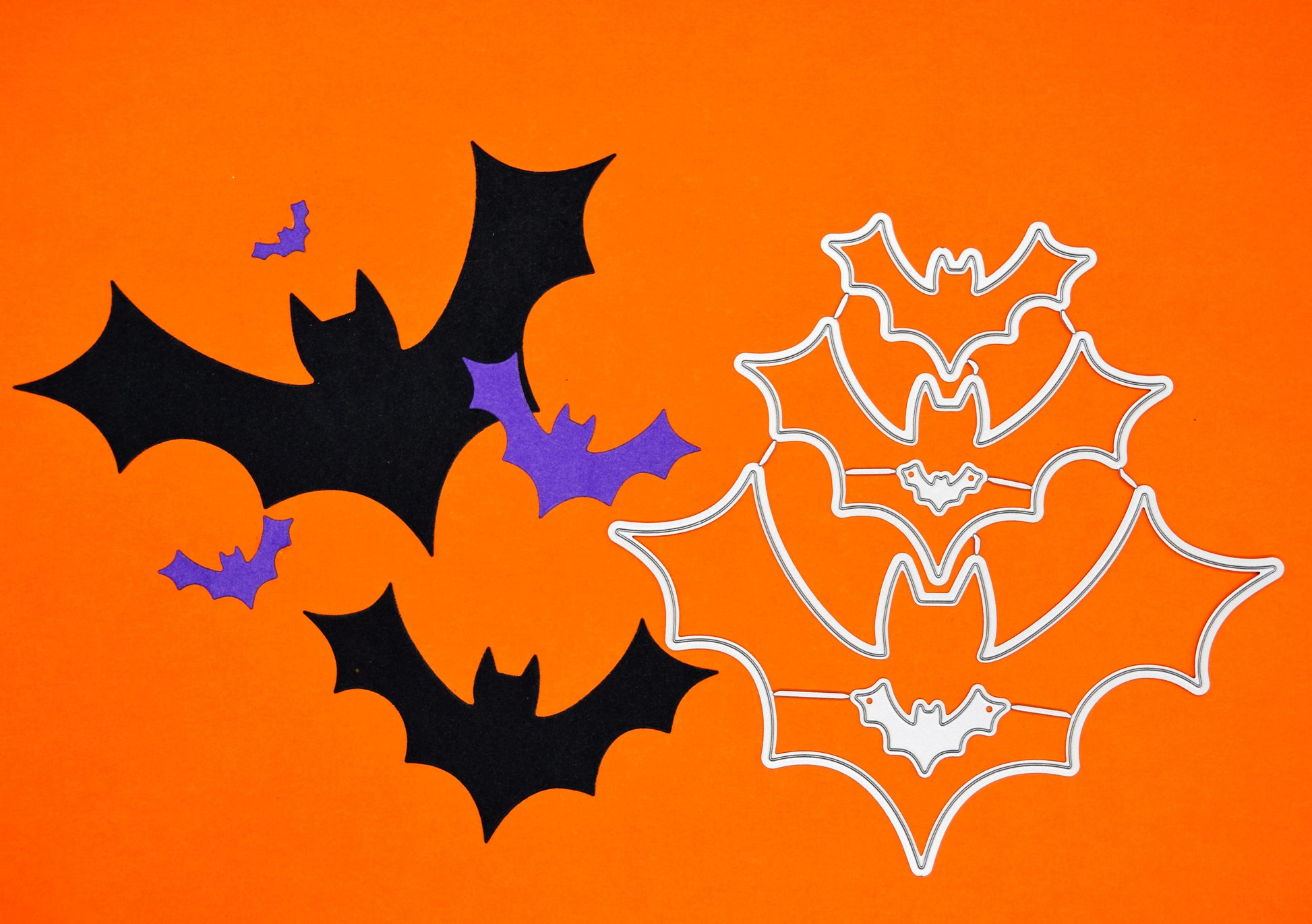Bat metal cutting dies shown alongside finished card cut shapes