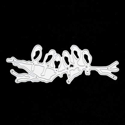 Birds on branch metal cutting die on black background