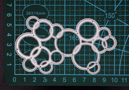 Bubble background metal cutting die size reference on cutting mat