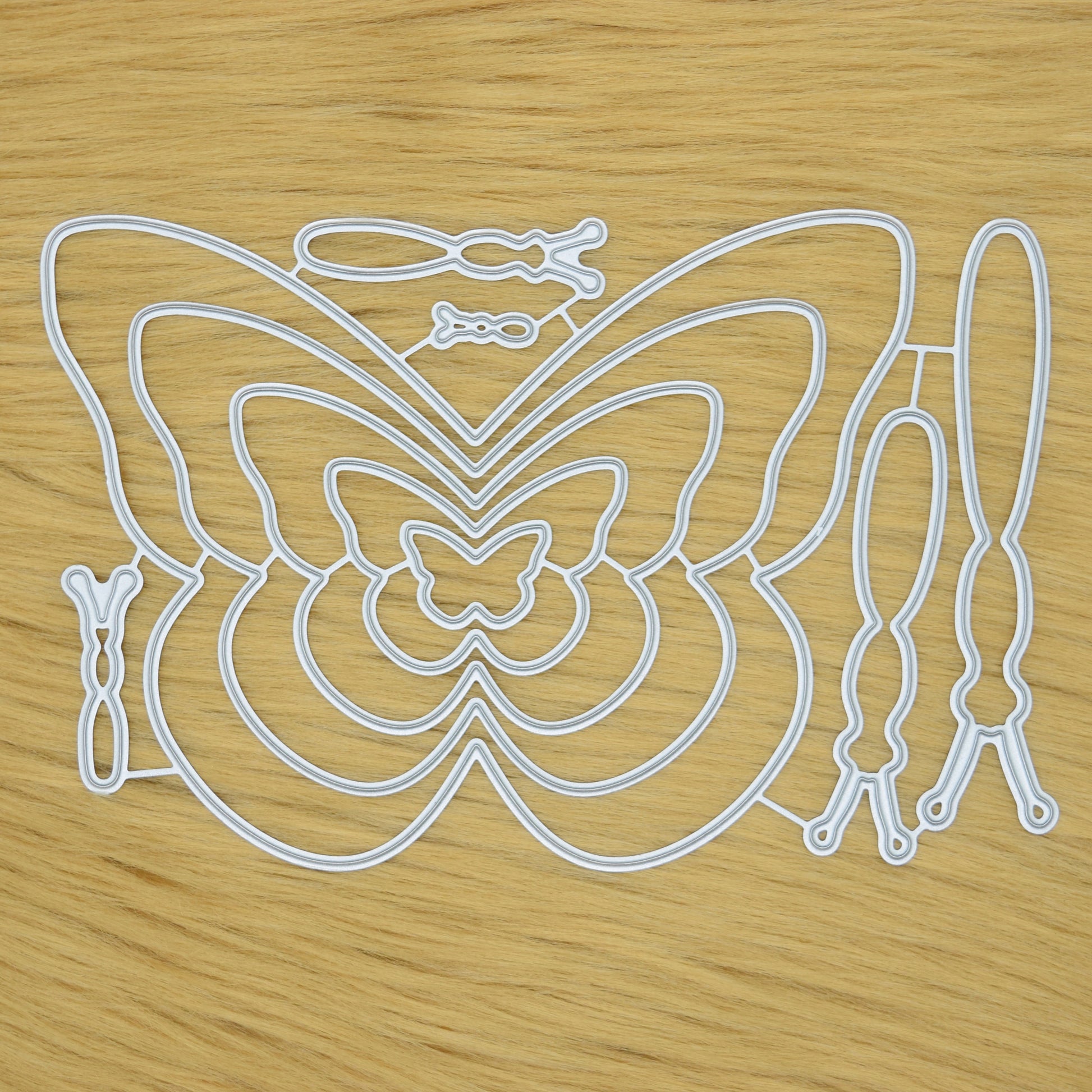 Butterfly metal cutting dies set on faux fur background