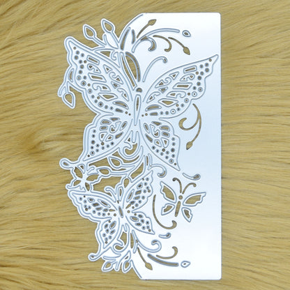 Detailed butterfly edge metal cutting die on faux fur background featuring two large butterflies, foliage and decorative cut-out flourishes.