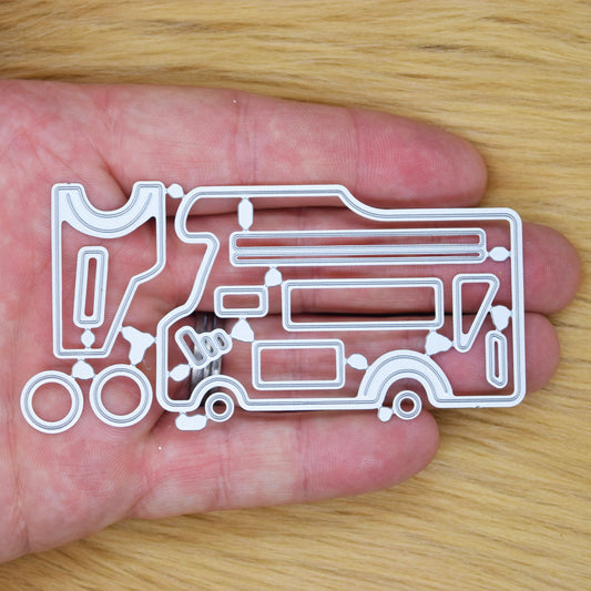 Camper van metal cutting dies set shown in hand for size reference