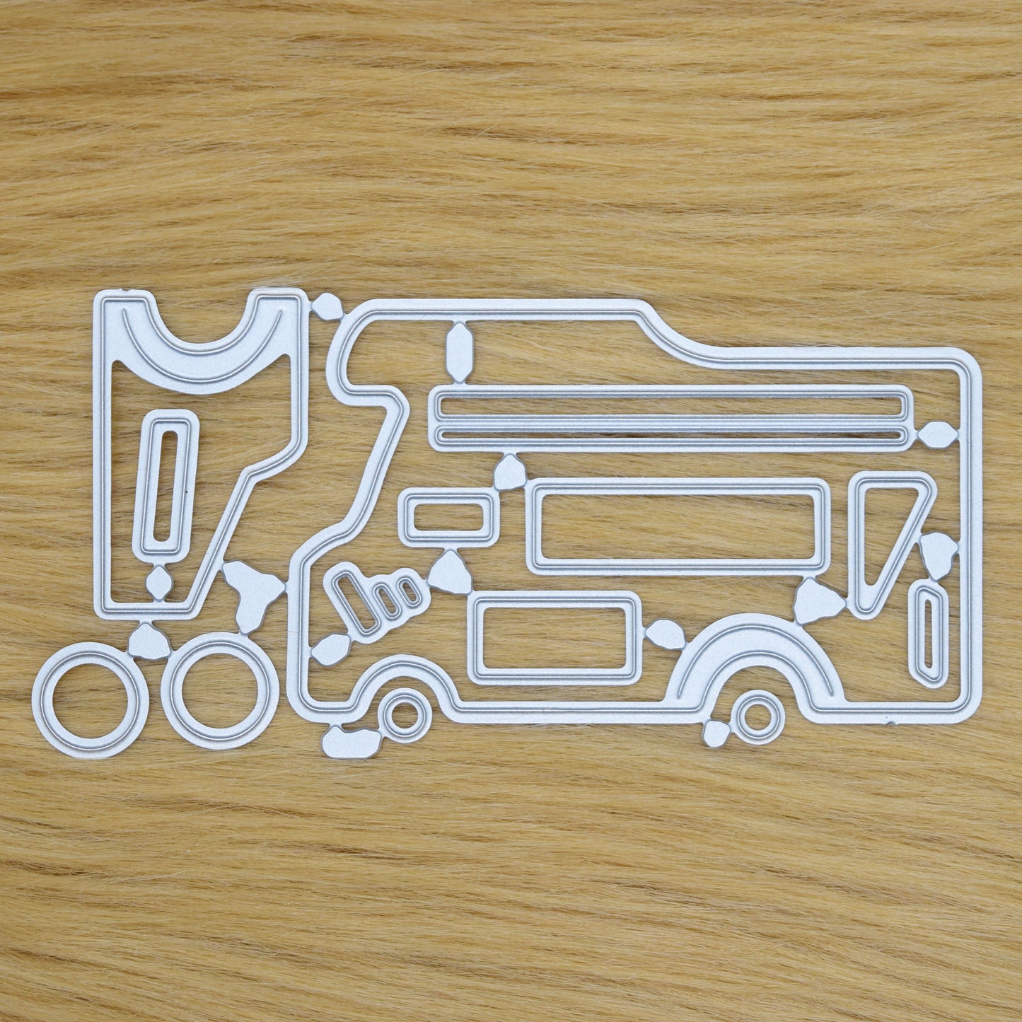 Motorhome camper van metal cutting dies set on faux fur background