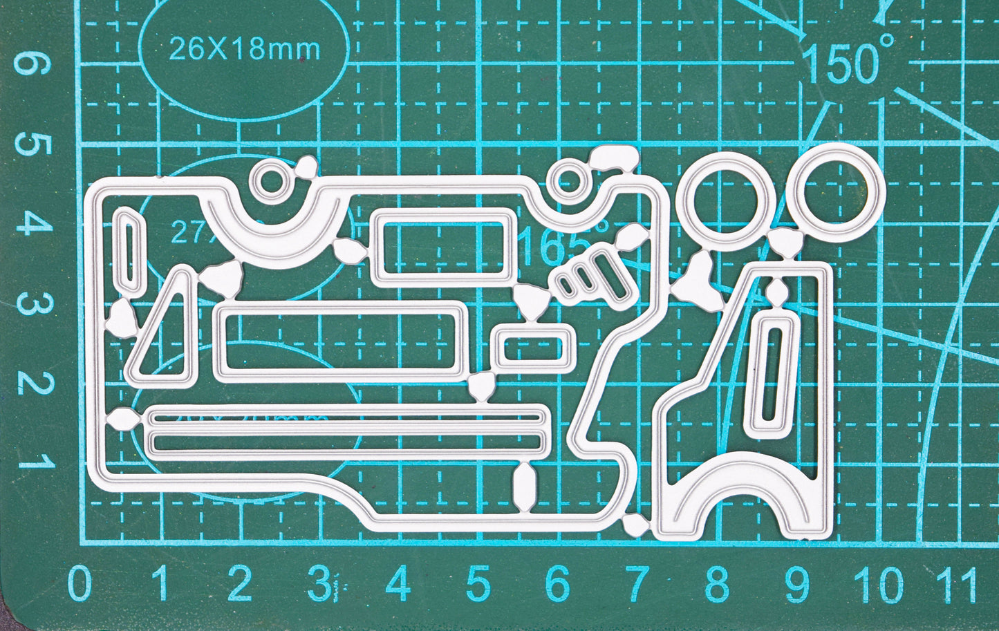Camper van metal cutting dies on cutting mat showing size