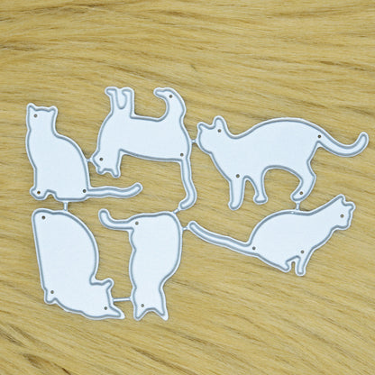 Set of six cat silhouette metal cutting dies arranged on a light tan faux fur background