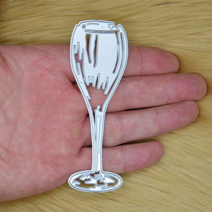 Champagne glass metal cutting die size comparison shown in hand