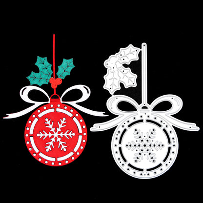 Finished red and white Christmas snowflake bauble paper cut displayed beside the matching metal cutting die.