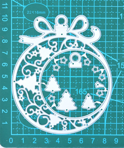 Large Christmas bauble frame metal cutting dies on a centimetre cutting mat, showing the overall size and smaller layering pieces.