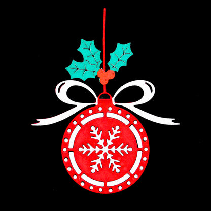 Finished red Christmas bauble ornament with white snowflake, ribbon bow and green holly leaves on a black background.