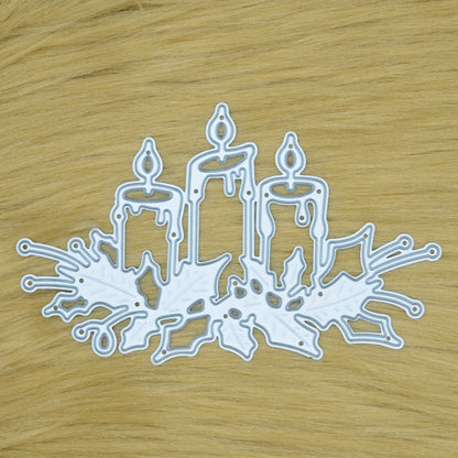 Christmas Candles & Holly metal cutting die displayed on a faux fur background for festive card making and papercraft projects.