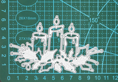 Christmas Candles & Holly metal cutting die displayed on a cutting mat to show scale for Christmas papercraft and card making.