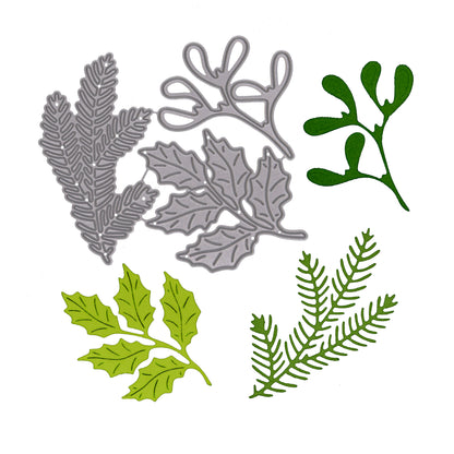 Holly, pine and mistletoe metal cutting dies shown with matching green paper cuts for Christmas card making and papercraft.