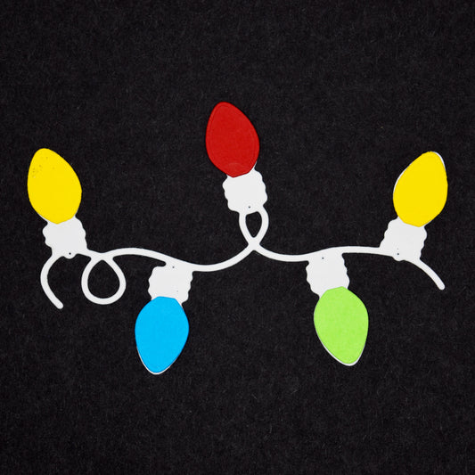 Colourful Christmas light bulb die cut sample made using festive garland metal cutting dies for papercraft