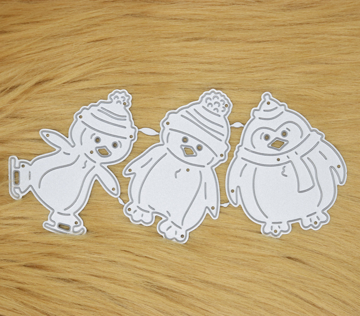 Christmas penguin metal cutting dies set with three festive penguin designs