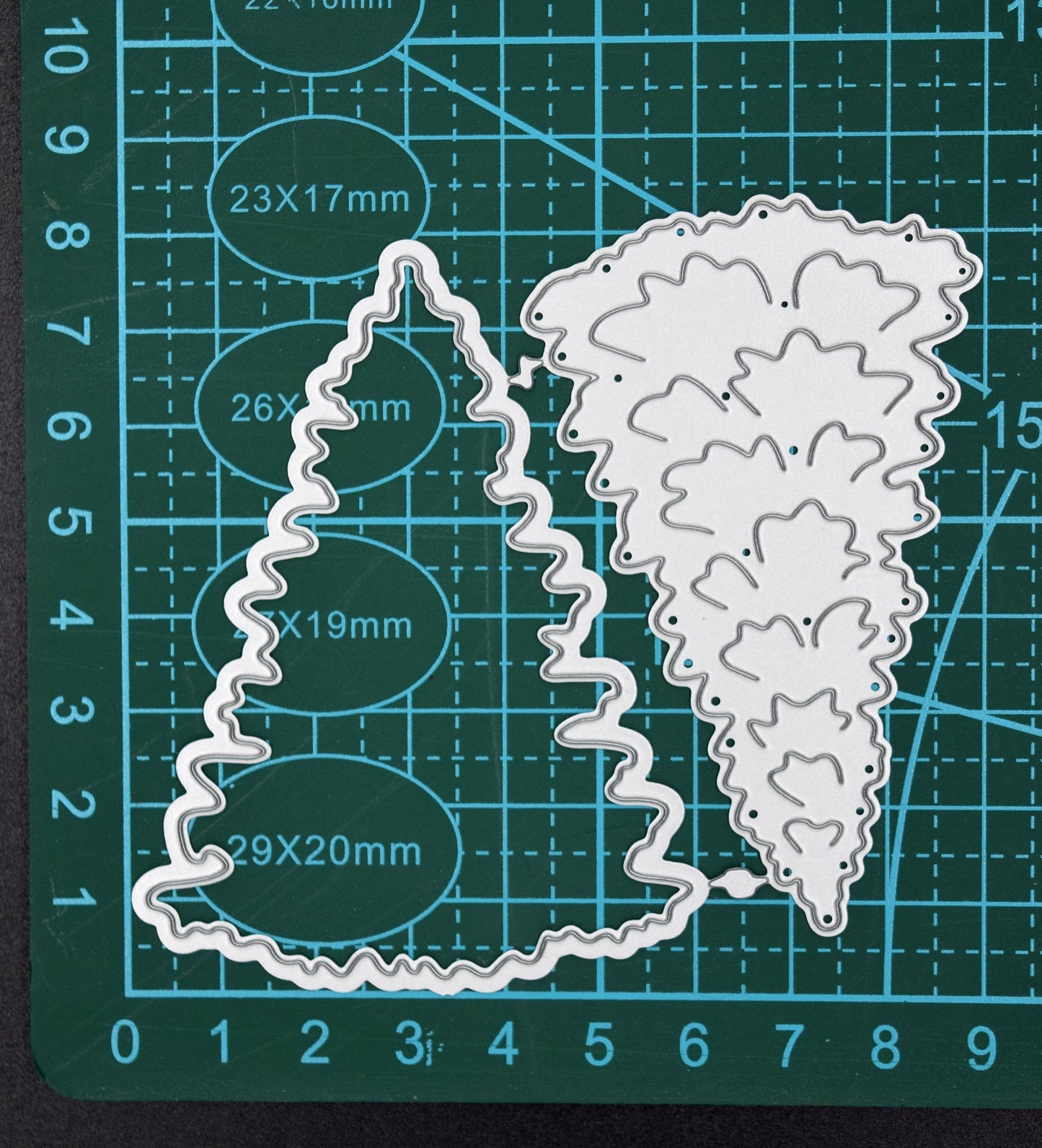 Christmas tree metal cutting die set on measuring mat for sizing reference