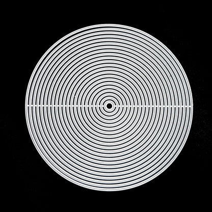 Full set of circle nesting metal cutting dies arranged on black background