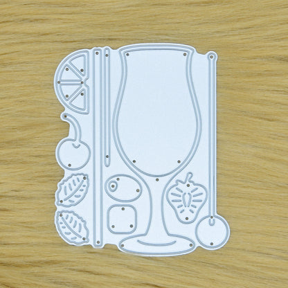 Cocktail glass and garnish metal cutting die set displayed on a faux fur background for card making and papercraft.