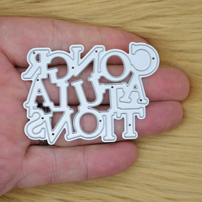 Congratulations sentiment metal cutting die held in hand showing size