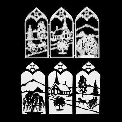 Countryside window scene metal cutting die shown with the finished black die cut featuring a church, trees, mountains and horse-drawn cart.