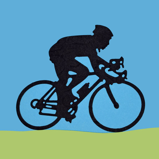 Cyclist die cut example in black card showing man riding racing bicycle on blue background