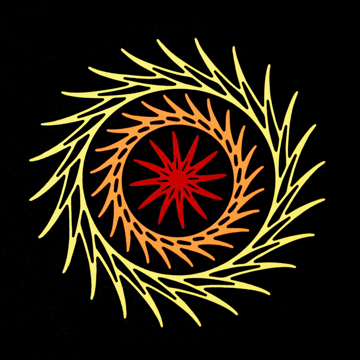 Layered decorative circular swirl dies used to create colourful frame design