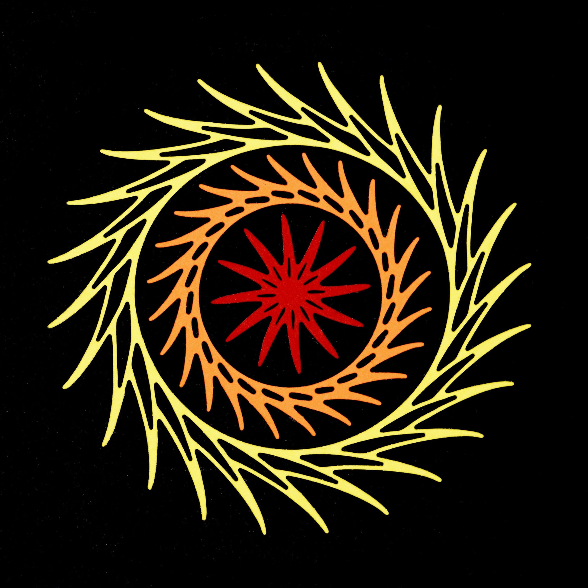 Layered decorative circular swirl dies used to create colourful frame design