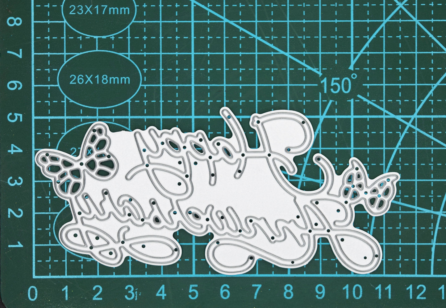 Happy Anniversary butterfly sentiment metal cutting die shown on cutting mat with measurements for card making