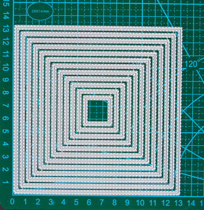 Set of 12 double stitched square metal cutting dies displayed on a centimetre cutting mat for size guidance.