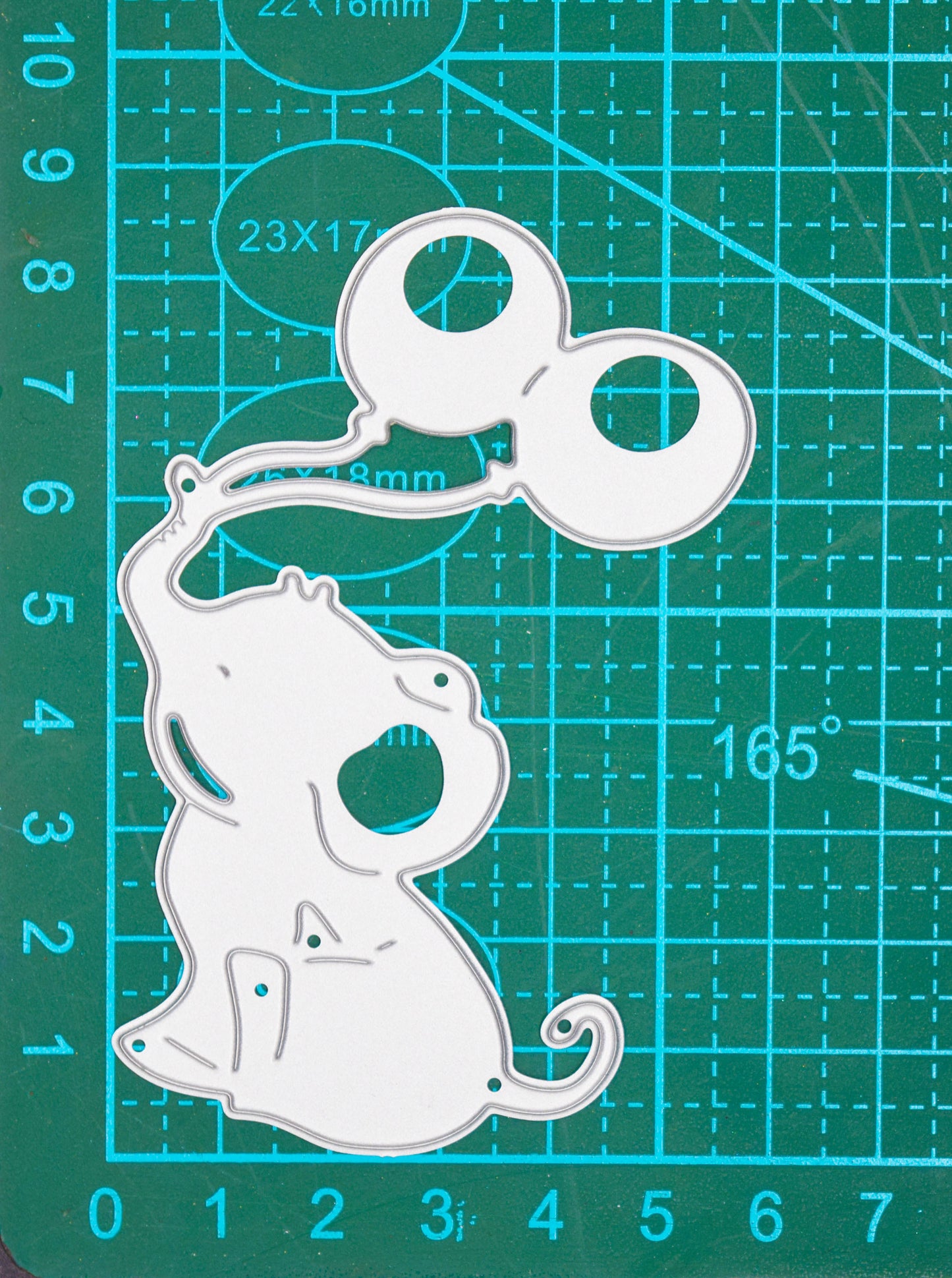 Baby elephant metal cutting die on measuring mat showing size
