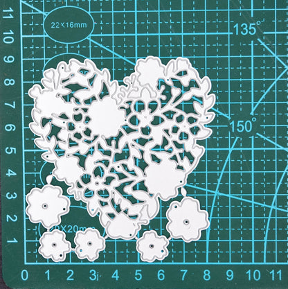 Floral heart metal cutting die set on cutting mat showing size