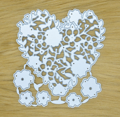 Floral heart metal cutting die set on faux fur background