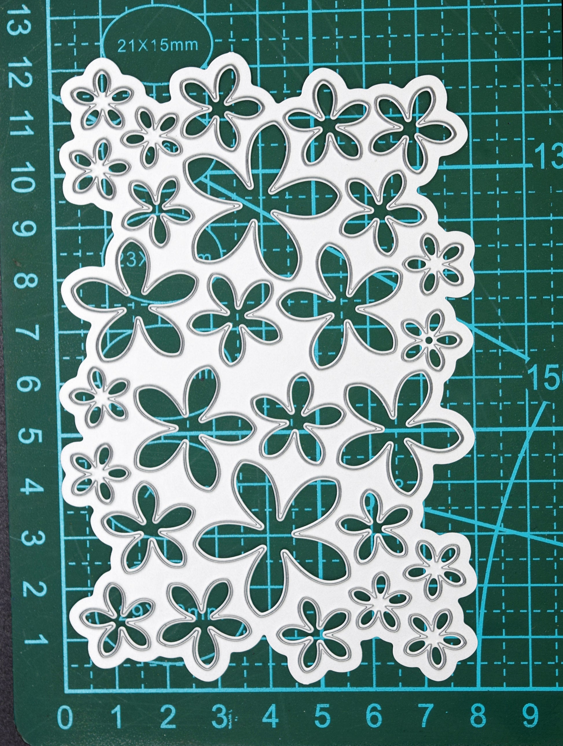 Flower background die on cutting mat showing measurements