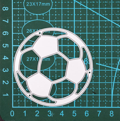 Football metal cutting die on measuring mat showing size