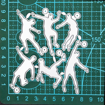 Football player metal cutting dies shown on a cutting mat for size reference
