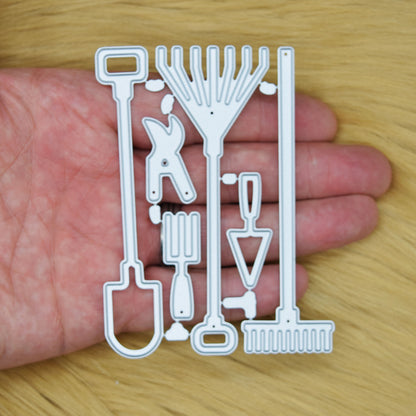 Garden hand tools metal cutting dies set shown in hand to demonstrate the die sizes