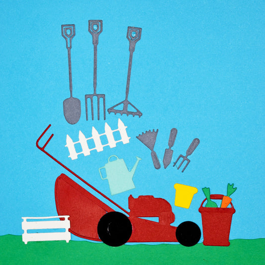 Finished garden scene made using gardening tools metal cutting dies including lawn mower, fence and hand tools for card making