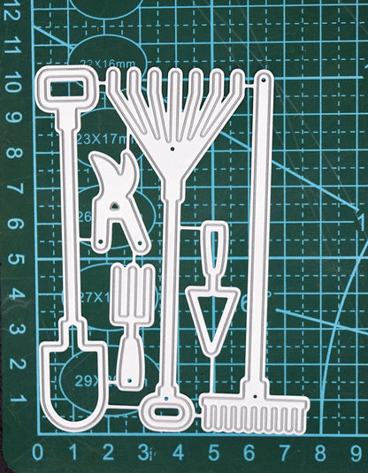 Garden hand tools metal cutting dies set shown on a cutting mat for size reference