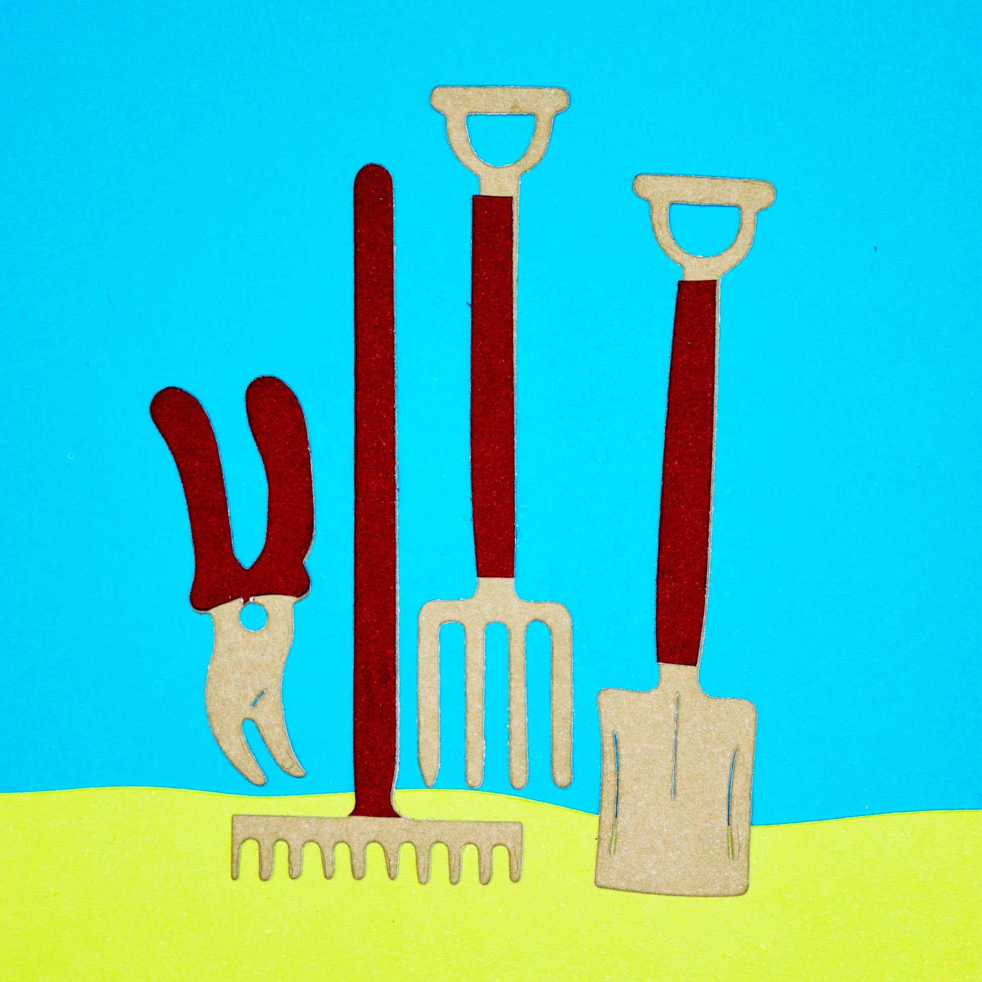 Colourful paper cuts of a spade, fork, rake and secateurs made with gardening tools metal cutting dies.