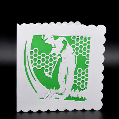 Finished greeting card made with golfer metal cutting die showing layered golf scene