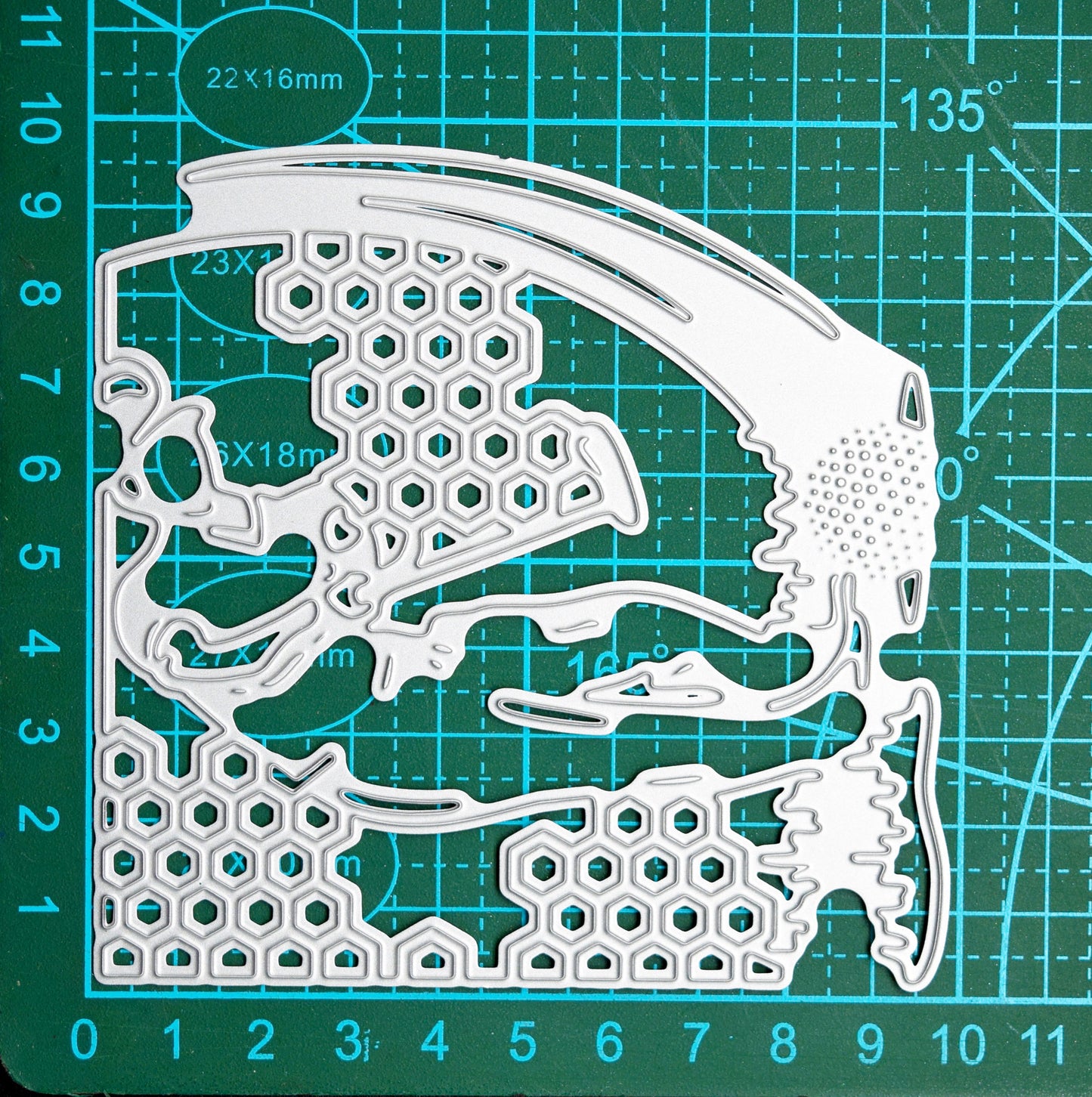 Golfer metal cutting die on cutting mat showing size and detail of golf scene design